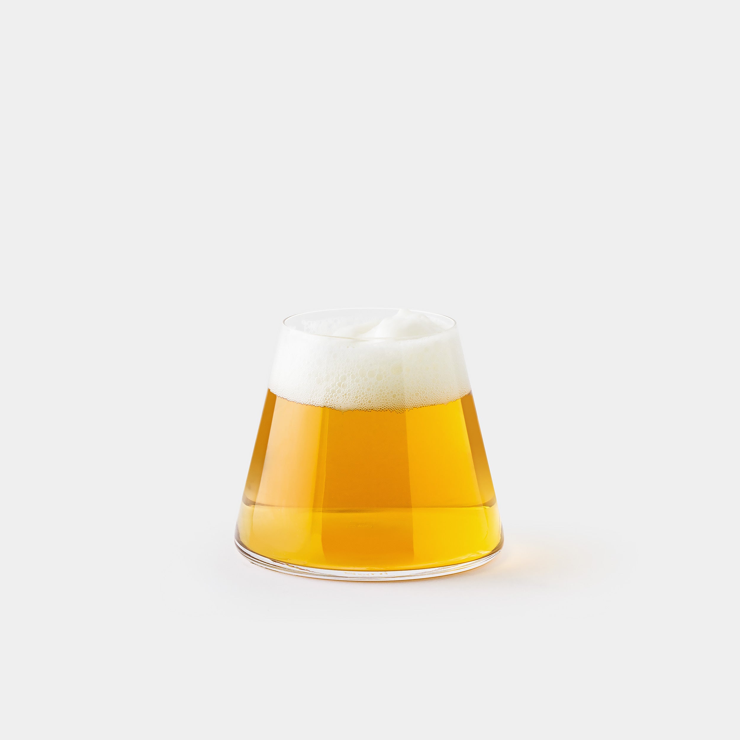 Fujiyama Glass revealing Mount Fuji silhouette with frothy lager.