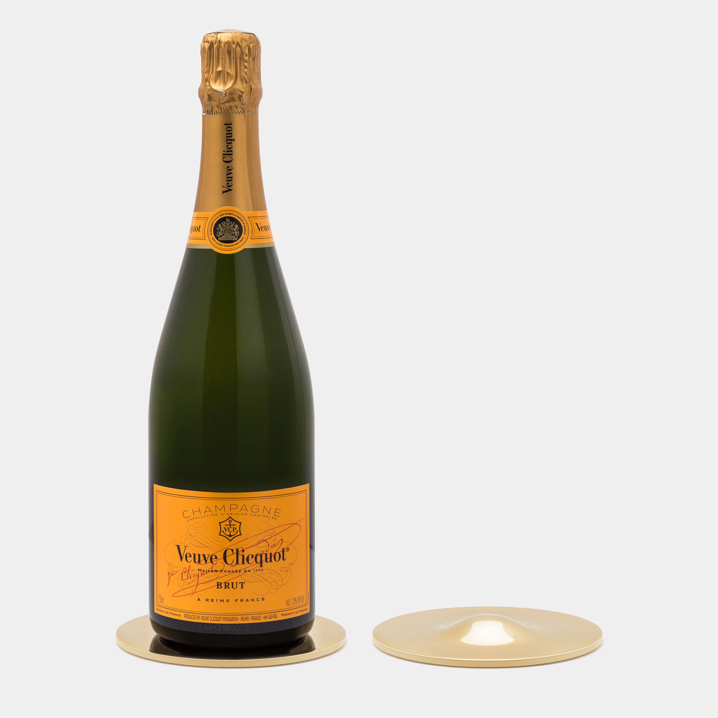 Skultuna Basso Wine and Champagne Bottle Coaster with champagne bottle