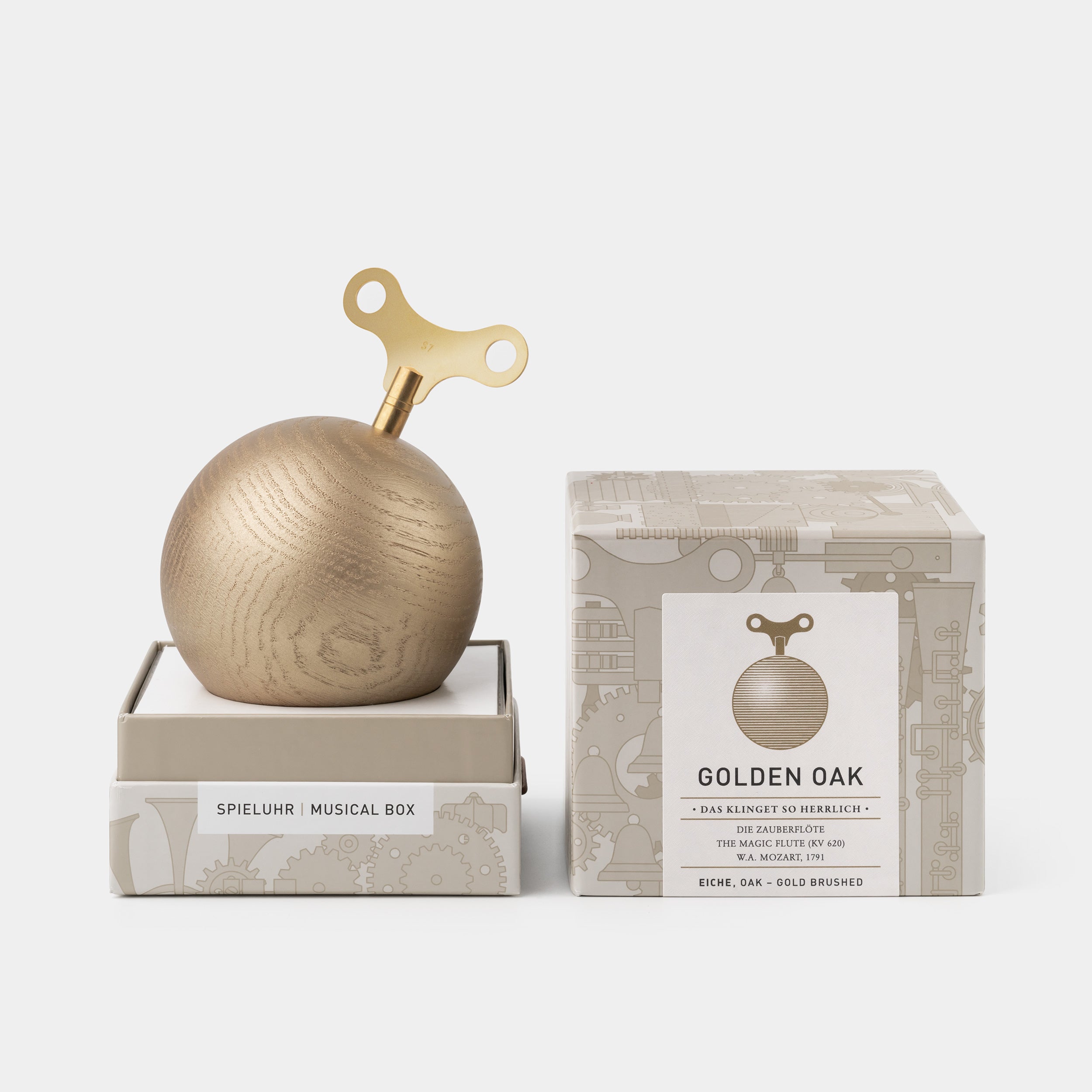 S7 Golden Oak music box displayed beside its illustrated premium presentation packaging.
