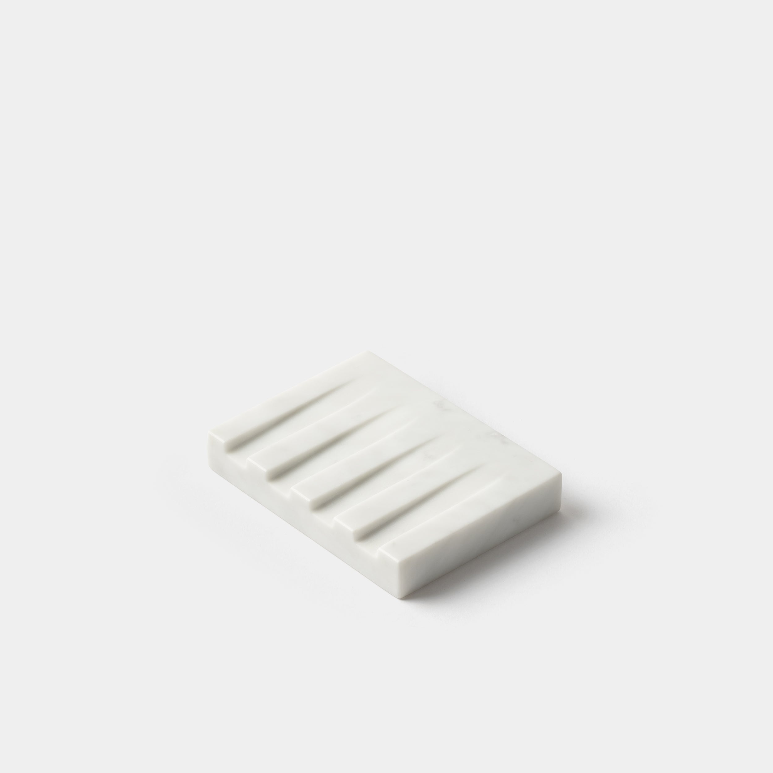 https://www.odetothings.com/cdn/shop/products/kristine-five-melvaer-soap-dish-carrara-angle.jpg?v=1653227375&width=2500